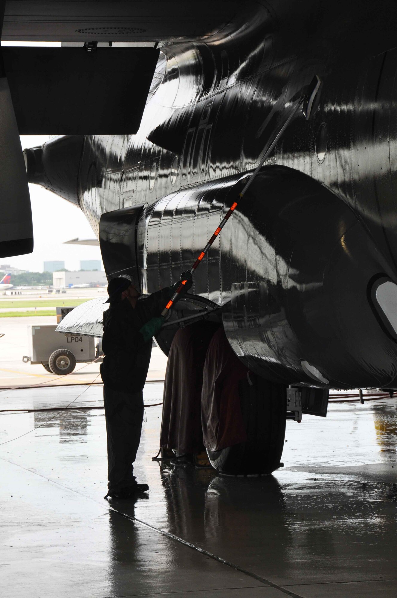 A 934th C-130 gets an early morning wash July 22.  Regular washing prevents corrosion of the aircraft. (Air Force Photo/Paul Zadach)