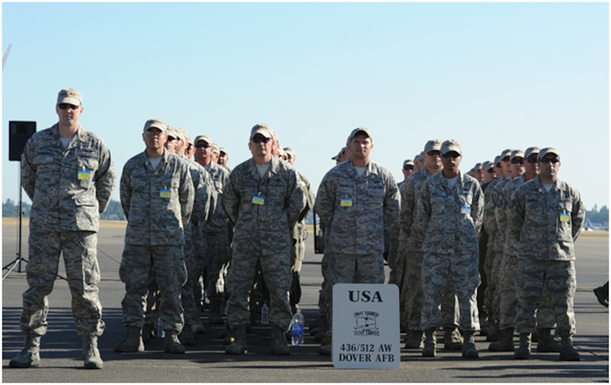 Competitors from Dover Air Force Base, Del., stand in formation while waiting for the opening ceremony at Joint Base Lewis McChord, Wash. Team Dover’s Rodeo Team includes the 436th Aerial Port Squadron, 3rd and 9th Airlift Squadron, 436th Comptroller Squadron, 436th Security Forces Squadron, 436th Aircraft Maintenance  Squadron, 436th Maintenance Squadron, 512 AMXS, 512 MXS, 736 AMXS and 712 AMXS.  (U.S. Air Force photo by 2nd Lt. Jennifer Guerrero)  