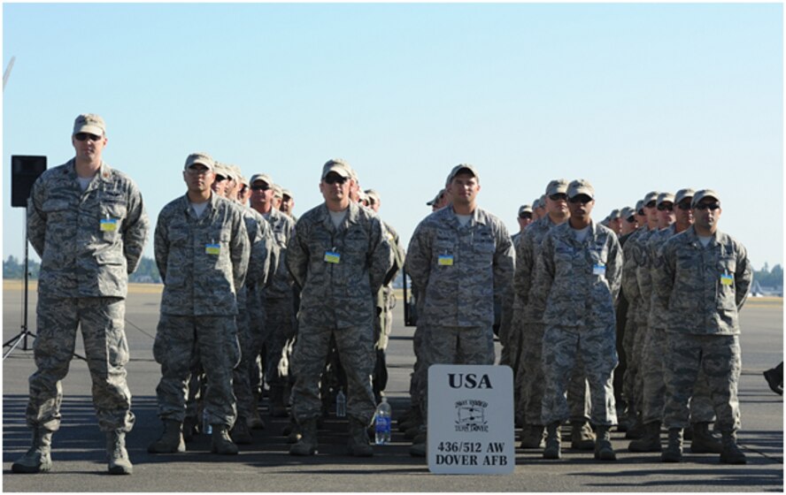 Competitors from Dover Air Force Base, Del., stand in formation while waiting for the opening ceremony at Joint Base Lewis McChord, Wash. Team Dover’s Rodeo Team includes the 436th Aerial Port Squadron, 3rd and 9th Airlift Squadron, 436th Comptroller Squadron, 436th Security Forces Squadron, 436th Aircraft Maintenance  Squadron, 436th Maintenance Squadron, 512 AMXS, 512 MXS, 736 AMXS and 712 AMXS.  (U.S. Air Force photo by 2nd Lt. Jennifer Guerrero)  
