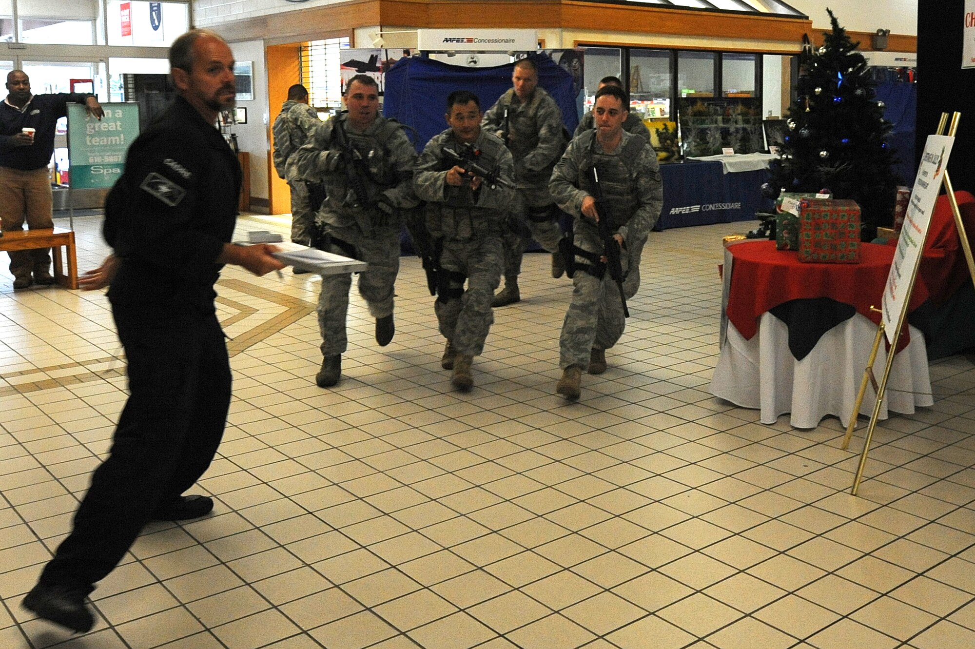 MISAWA AIR BASE, Japan -- Jon Mulcahy, a High Risk Response Training course instructor, observes as members of the 35th Security Forces Squadron, respond to a simulated active shooter scenario at the Base Exchange 22 July.  The High Risk Response Training course was conducted by the Pacific Air Force's Mobile Team and is a five-day program to help PACAF prepare to meet dangerous and unpredictable situations on military installations that require immediate action.  (U.S. Air Force photo/Staff Sgt. April Quintanilla)