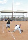 Mark Watson runs on base en route to home plate after hitting a homerun out of the park in the fourth inning. Radiology defeated 668 ALIS 9-1 to be crowned 2011 Intramural Softball Champions. (U.S. Air Force photo by/Alan Boedeker)