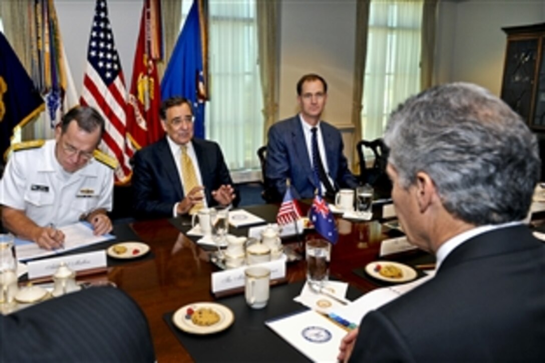 U.S. Defense Secretary Leon Panetta, center, hosts a meeting with Australian Defense Minister Stephen Smith, right foreground, at the Pentagon, July 27, 2011. U.S. Navy Adm. Mike Mullen, chairman of the Joint Chiefs of Staff, left, and James Miller, right, principal deputy undersecretary of defense for policy, joined Panetta.