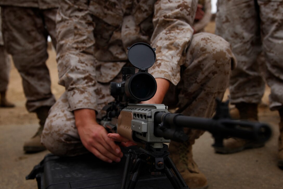 A Marine with the 15th Marine Expeditionary Unit (MEU) Command Element gets a feel for an Enhanced Marksmanship Rifle (EMR) as a part of a familiarization fire range conducted on Camp Pendleton, July 26-27.