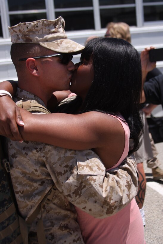 Loved ones kiss for the first time in 7 months at the 1st Tanks homecoming July 28, 2011. Company D was among the first wave of tanks to enter Afghanistan.