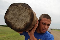 Weston Droegemueller, 16, from Wayzata, Minn., leads his team on a 2.5-mile log race competition during the All-Marine Wrestling Camp July 28. Droegemueller, a 135-pound Minnesota state qualifier, will be a junior at Plymouth High School. For additional imagery from the event, visit www.facebook.com/rstwincities.