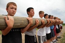 Matt Muedeking, also known as "Jimmy Neutron" by his fellow wrestlers, wasn't phased by the 35-foot log his team had to carry during a 2.5-mile race at the All-Marine Wrestling Camp July 28. Muedeking will be a seventh grader at White Bear Lake Middle School. For additonal imagery from the event, visit www.facebook.com/rstwincities.