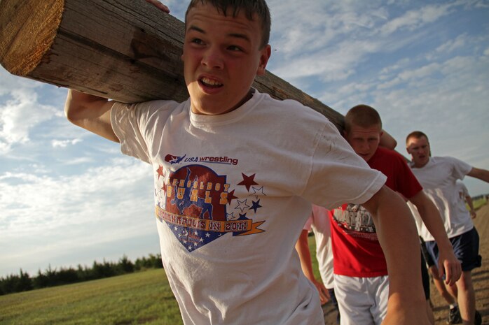 Zumbrota-Mazeppa High School's Joey Majerus and Mitchell Watkins lead their team run down the final stretch of a 2.5-mile log race competition at the All-Marine Wrestling Camp July 28. Majerus is a Minnesota state qualifier at 103 pounds. For additional imagery from the event, visit www.facebook.com/rstwincities.