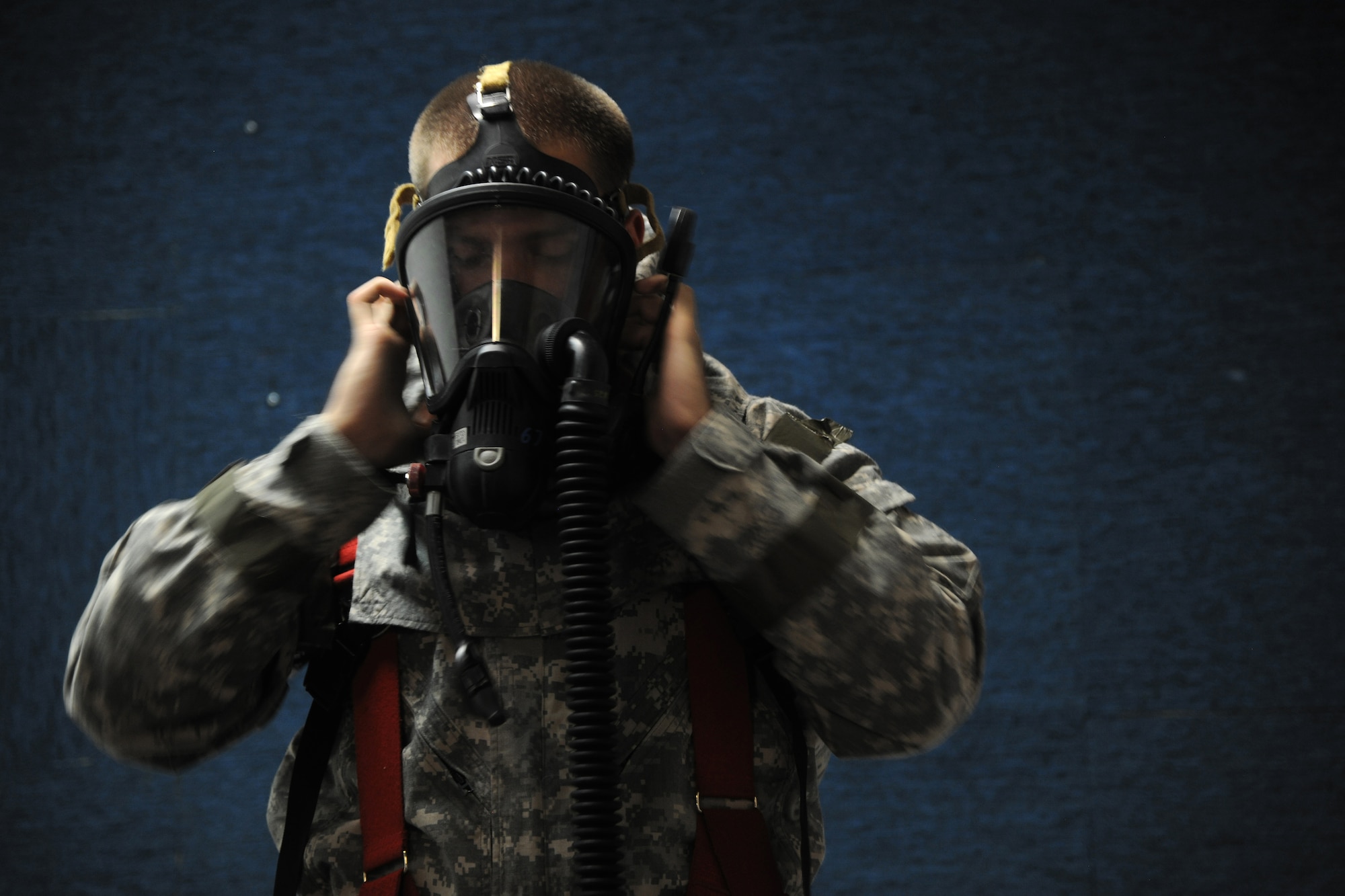 KUNSAN AIR BASE, Republic of Korea -- Senior Airman Daniel Couey, 8th Civil Engineer Squadron firefighter, practices donning and doffing procedures with their new Joint Firefighter's Integrated Response Ensemble (J-FIRE) suits here July 28. Airmen were participating in a final field evaluation of the suit testing the time to put on the J-FIRE suits versus the previous version. (U.S. Air Force photo/Staff Sgt. Rasheen Douglas)
