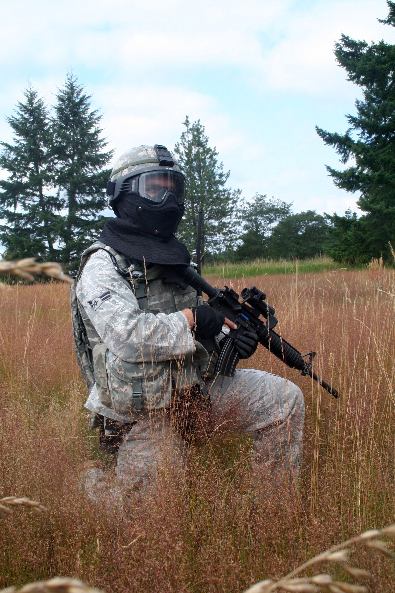 A security forces Airman participates in the security forces tactics team competition for Air Mobility Rodeo 2011 on July 26, 2011, at Joint Base Lewis-McChord, Wash. Collins is from the 421st Combat Training Squadron at Joint Base McGuire-Dix-Lakehurst, N.J. Rodeo 2011, sponsored by the Air Mobility Command, is the Mobility Air Force's readiness competition. This competition focuses on improving worldwide air mobility forces' professional core abilities. More than 150 teams and 3,000 people from the Air Force, and Air Force Reserve, as well as allied nations are participating in Rodeo. (U.S. Air Force Photo/Master Sgt. Scott T. Sturkol)