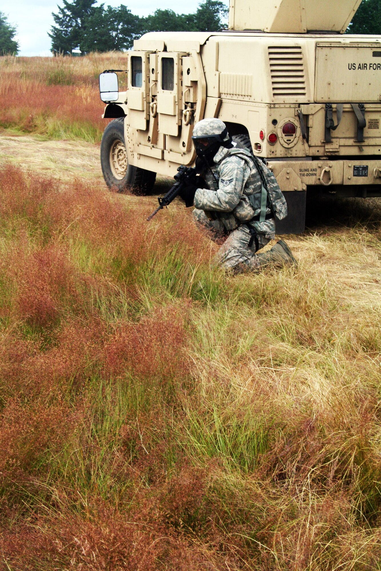 A security forces Airman participates in the security forces tactics team competition for Air Mobility Rodeo 2011 on July 26, 2011, at Joint Base Lewis-McChord, Wash. Collins is from the 421st Combat Training Squadron at Joint Base McGuire-Dix-Lakehurst, N.J. Rodeo 2011, sponsored by the Air Mobility Command, is the Mobility Air Force's readiness competition. This competition focuses on improving worldwide air mobility forces' professional core abilities. More than 150 teams and 3,000 people from the Air Force, and Air Force Reserve, as well as allied nations are participating in Rodeo. (U.S. Air Force Photo/Master Sgt. Scott T. Sturkol)