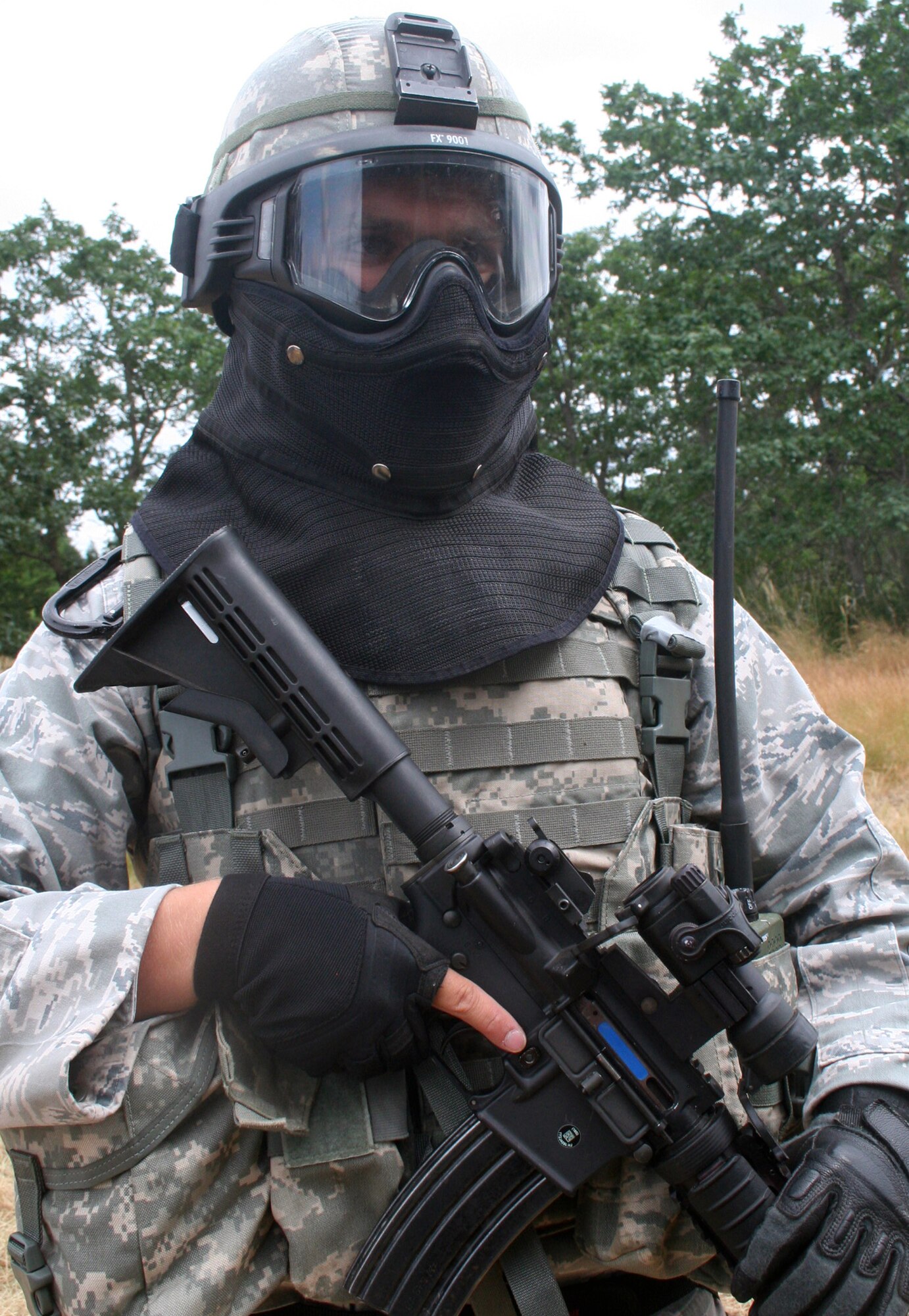 A security forces Airman participates in the security forces tactics team competition for Air Mobility Rodeo 2011 on July 26, 2011, at Joint Base Lewis-McChord, Wash. Collins is from the 421st Combat Training Squadron at Joint Base McGuire-Dix-Lakehurst, N.J. Rodeo 2011, sponsored by the Air Mobility Command, is the Mobility Air Force's readiness competition. This competition focuses on improving worldwide air mobility forces' professional core abilities. More than 150 teams and 3,000 people from the Air Force, and Air Force Reserve, as well as allied nations are participating in Rodeo. (U.S. Air Force Photo/Master Sgt. Scott T. Sturkol)
