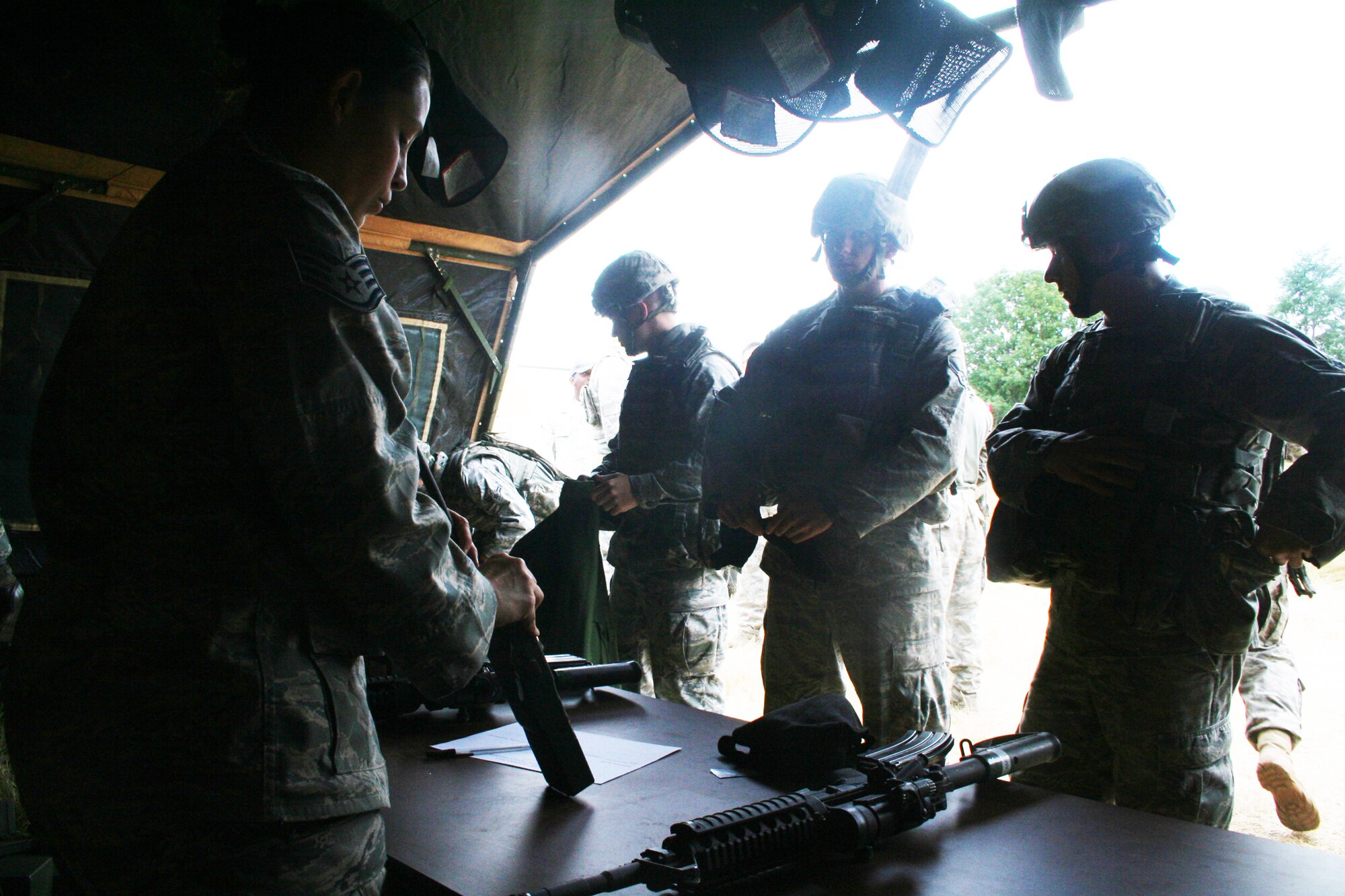 Staff Sgt. Lucinda Collins briefs a security forces team during the security forces tactics team competition for Air Mobility Rodeo 2011 on July 26, 2011, at Joint Base Lewis-McChord, Wash. Collins is from the 421st Combat Training Squadron at Joint Base McGuire-Dix-Lakehurst, N.J. Rodeo 2011, sponsored by the Air Mobility Command, is the Mobility Air Force's readiness competition. This competition focuses on improving worldwide air mobility forces' professional core abilities. More than 150 teams and 3,000 people from the Air Force, and Air Force Reserve, as well as allied nations are participating in Rodeo. (U.S. Air Force Photo/Master Sgt. Scott T. Sturkol)