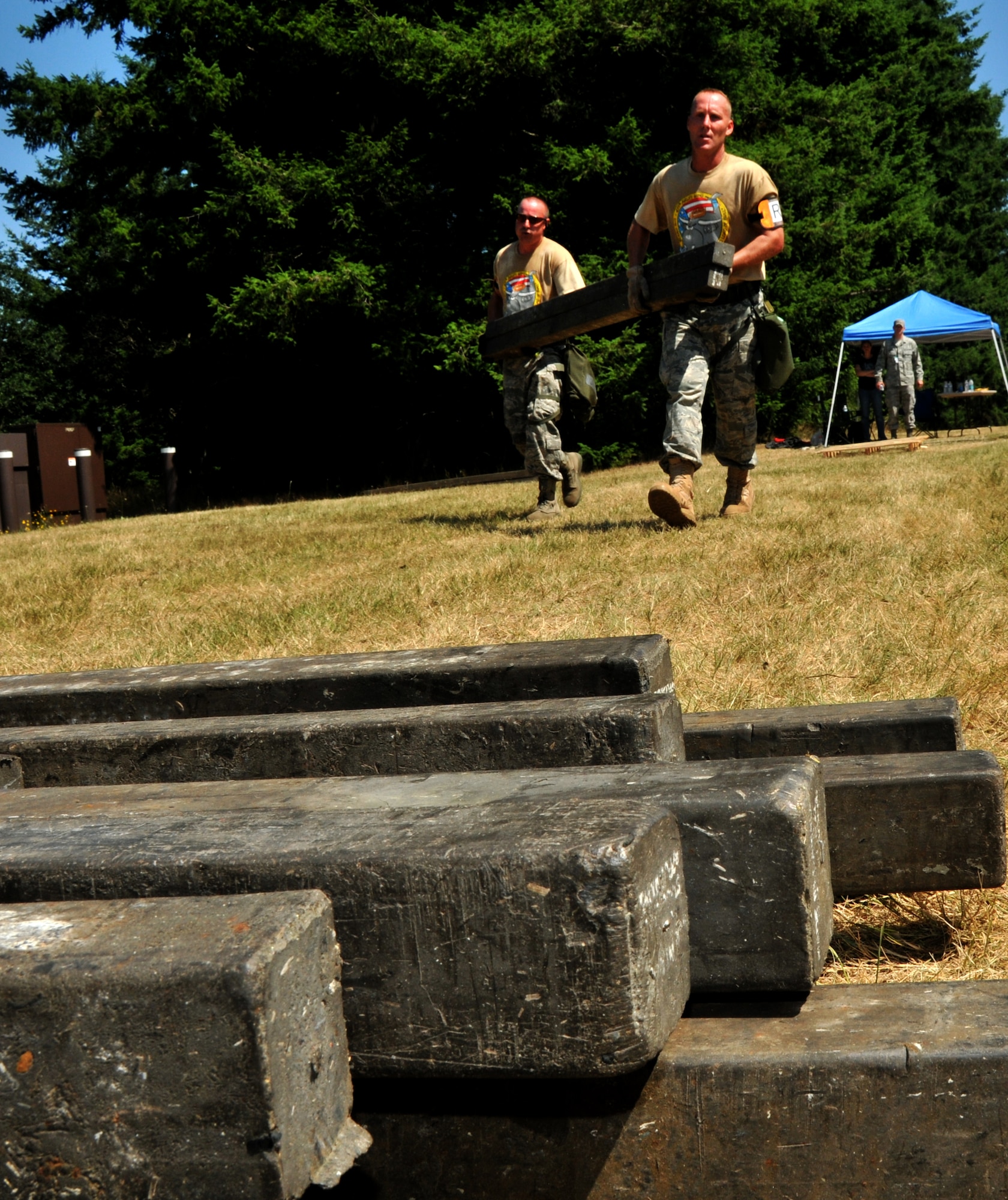 Airmen transport dunage, July 28, 2011 at Joint Base Lewis-McChord, Wash., during an aerial port obstacle course. The event was part of Air Mobility Rodeo 2011, a biennial international competition that focuses on mission readiness, featuring airdrops, aerial refueling and other events that showcase the skills of mobility crews from around the world. (U.S. Air Force photo/Airman 1st Class Jared Trimarchi) 

