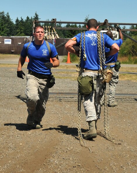Airmen move tie-down chains, July 28, 2011 at Joint Base Lewis-McChord, Wash., during an aerial port obstacle course. The event was part of Air Mobility Rodeo 2011, a biennial international competition that focuses on mission readiness, featuring airdrops, aerial refueling and other events that showcase the skills of mobility crews from around the world. (U.S. Air Force photo/Airman 1st Class Jared Trimarchi) 