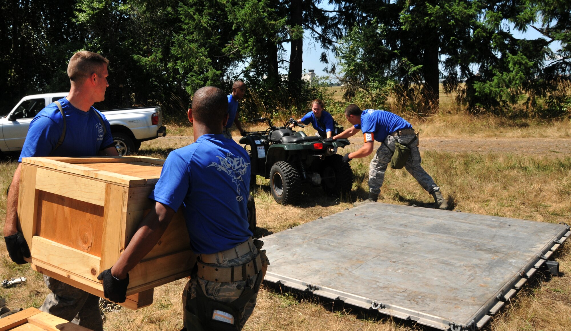Airmen build a pallet, July 28, 2011 at Joint Base Lewis-McChord, Wash., during an aerial port obstacle course. The event was part of Air Mobility Rodeo 2011, a biennial international competition that focuses on mission readiness, featuring airdrops, aerial refueling and other events that showcase the skills of mobility crews from around the world. (U.S. Air Force photo/Airman 1st Class Jared Trimarchi) 
