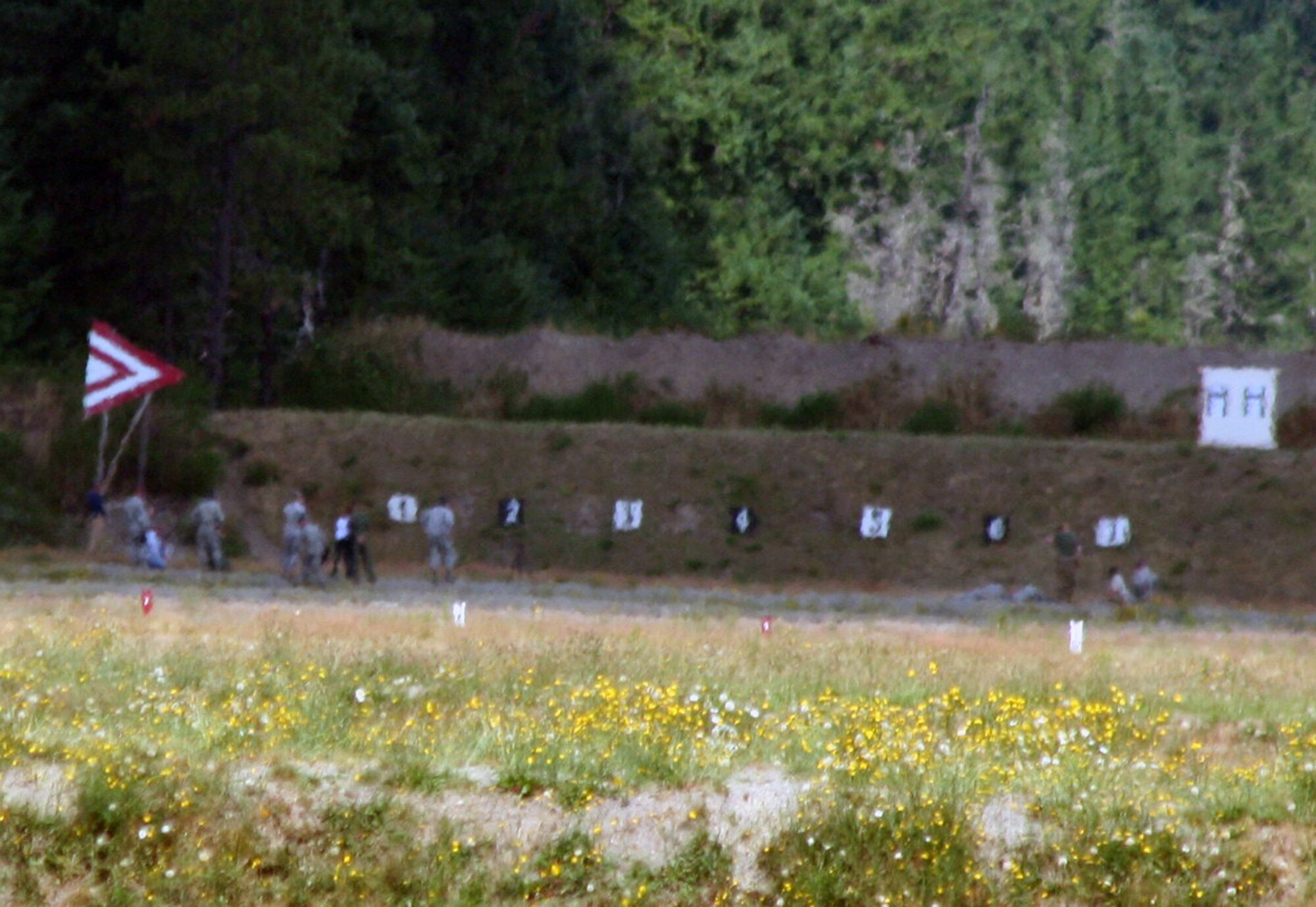 An advanced marksmanship team competes on a range on Joint Base Lewis-McChord, Wash., on July 27, 2011. Eleven teams participated in the ADM competition for Air Mobility Rodeo 2011. (U.S. Air Force Photo/Master Sgt. Scott T. Sturkol)