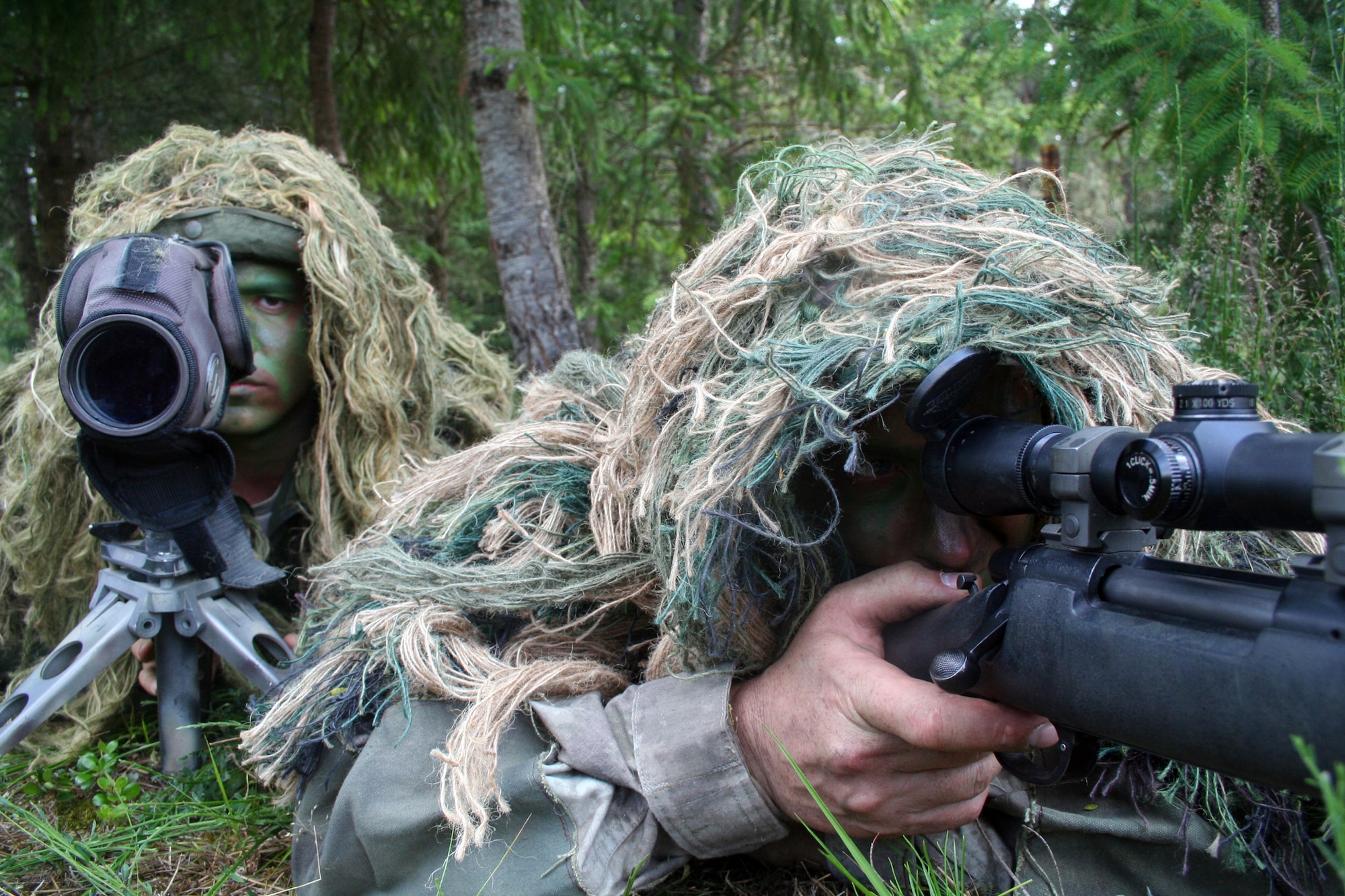 Staff Sgt. George Reinas and Senior Master Sgt. Nathan Brett, both sniper-qualified Airmen in the Air Force, practice a scenario on a range on Joint Base Lewis-McChord, Wash., on July 27, 2011. Brett and Reinas were the event coordinators for the advanced marksmanship event for Air Mobility Rodeo 2011 at Joint Base Lewis-McChord. Brett is the superintendent of the U.S. Air Force Expeditionary Center's 421st Combat Training Squadron at Joint Base McGuire-Dix-Lakehurst, N.J., and Reinas is a security forces combat skill instructor in the 421st CTS. (U.S. Air Force Photo/Master Sgt. Scott T. Sturkol)