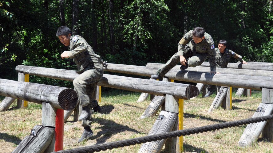 Members of the Republic of Korea air force, participate in the Security Forces combat endurance course at the Air Mobility Rodeo 2011 July 28, 2011 at Joint Base Lewis-McChord, Wash. (U.S. Air Force photo/Airman 1st Class Michael Battles)