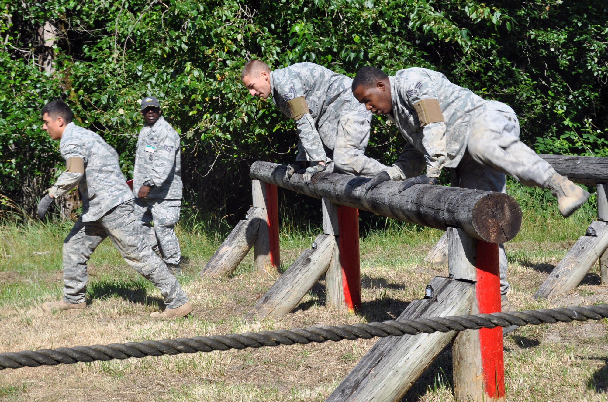Members of the 317th Airlift Group, participate in the Security Forces combat endurance course at the Air Mobility Rodeo 2011 July 28, 2011 at Joint Base Lewis-McChord, Wash. (U.S. Air Force photo/Airman 1st Class Michael Battles)