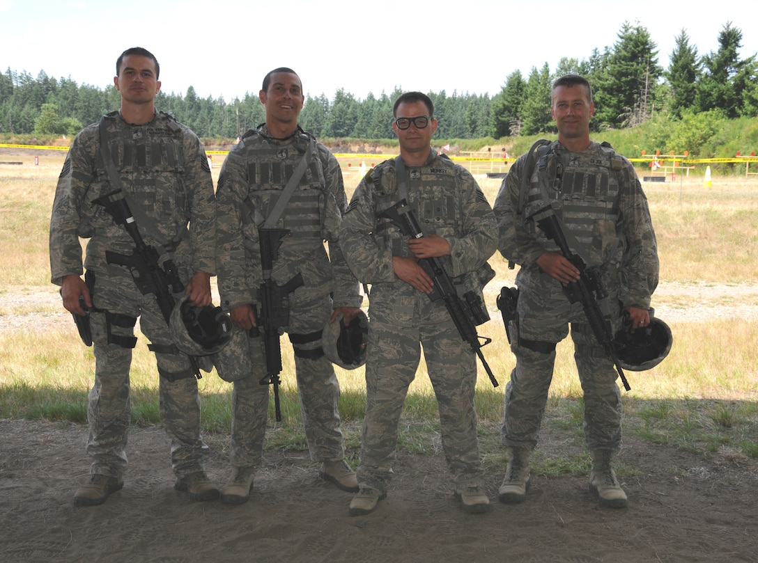 Meet your 2011 Security Forces Rodeo Team.  Tech. Sgt. Jack Montez, Staff Sgt. David Buchanon, Staff Sgt. Damon Hahn, and Tech. Sgt. Christopher Pierce competed in the combat weapons competition Wednesday at the firing range at Joint Base Lewis McChord-Lewis Main. All four Reservists are part of the 446th Security Forces Squadron at McChord Field.(U.S. Air Force photo by 2nd Lt. Denise Hauser)