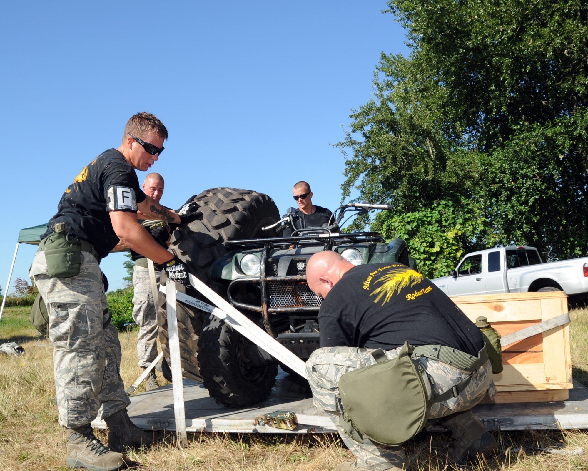 JOINT BASE LEWIS-MCCHORD, Wash. – The 97th Logistics Readiness Squadron Rodeo Team from Altus Air Force Base, Okla., assembles items onto a palette during the 2011 Air Mobility Command Rodeo Challenge Course July 28, 2011. During the Challenge Course, the five-man team from 97th LRS ran a 3.6 mile, 14-obstacle course that challenged their physical ability and team work. (U.S. Air Force photo by Airman 1st Class Kenneth W. Norman / Released / 97th Air Mobility Wing Rode Public Affairs)