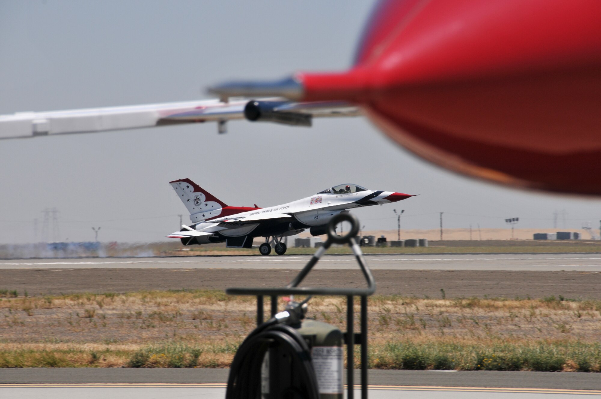 TRAVIS AIR FORCE BASE, Calif. --Aircraft number 5 of The Thunderbirds touches down in preparation for the air show scheduled here at Travis. The Air Force precision flying team was the air shows main event held  at the base on  the 30th and 31st of July. (U.S. Air Force photo/Master Sgt. Robert Wade)