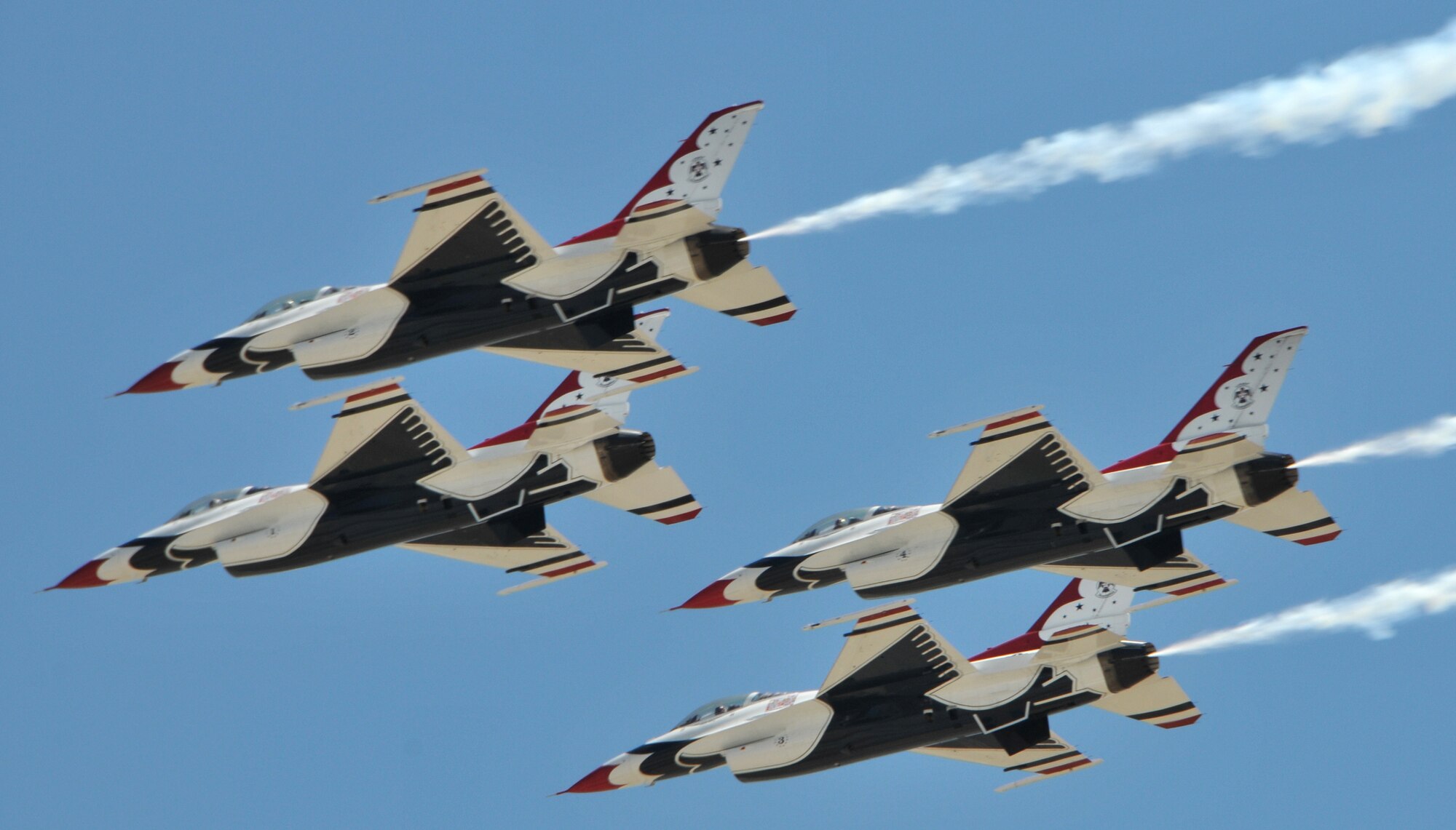 TRAVIS AIR FORCE BASE, Calif. -- The Thunderbirds perform a fly-by during their arrival in preparation for the air show scheduled here at Travis. The Air Force precision flying team was the air shows main event held  at the base on  the 30th and 31st of July. (U.S. Air Force photo/Master Sgt. Robert Wade)