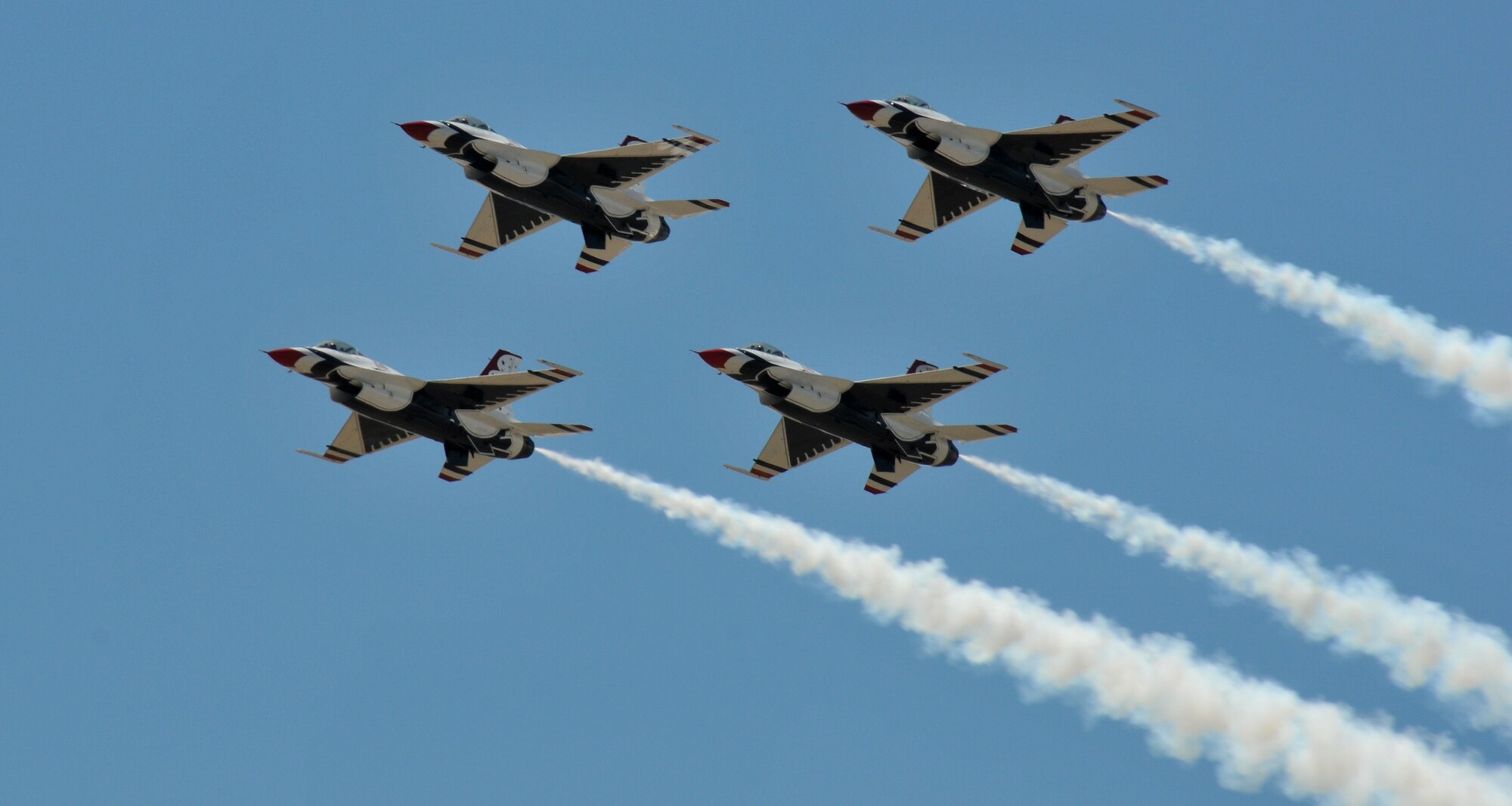TRAVIS AIR FORCE BASE, Calif. -- The Thunderbirds perform a fly-by during their arrival in preparation for the air show scheduled here at Travis. The Air Force precision flying team was the air shows main event held  at the base on  the 30th and 31st of July. (U.S. Air Force photo/Master Sgt. Robert Wade)