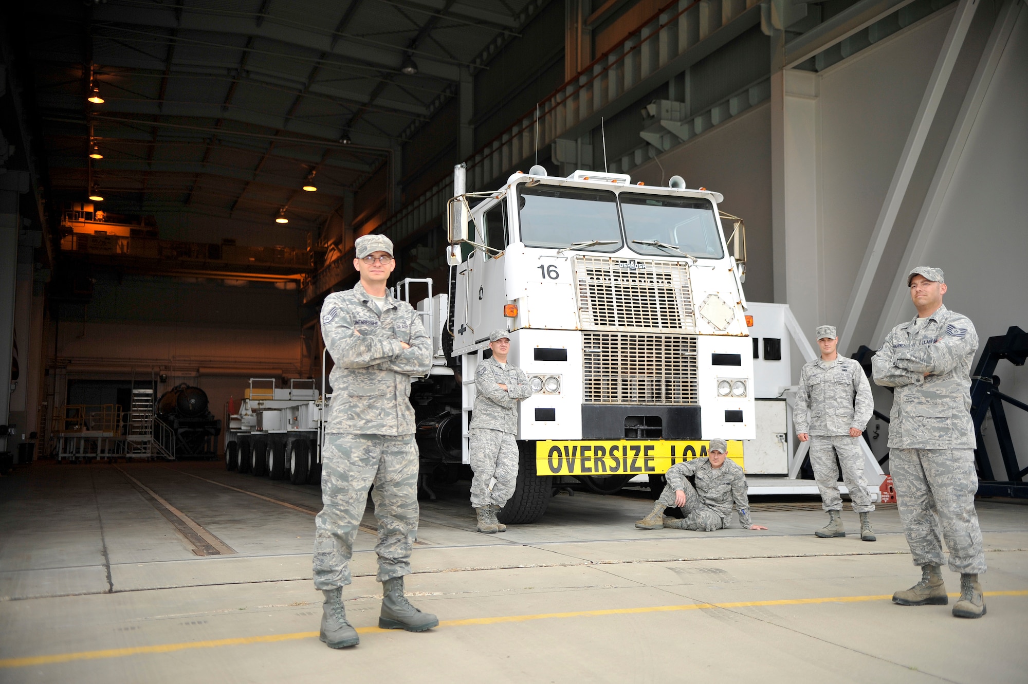 VANDENBERG AIR FORCE BASE, Calif. -- 1st Air and Space Test Squadron maintenance technicians, pose for a group photo in front of a transporter vehicle here Tuesday, July 19, 2011.   (U.S. Air Force photo/Staff Sgt. Andrew Satran) 

  
  