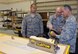 452nd Maintenance Squadron technicians Tech. Sgt. Brad Rosario (left) and Master Sgt. Bryan Shifflett demonstrate the use of a new sander with Col. Karl McGregor, 452nd Air Mobility Wing commander, during his tour of the KC-135 Stratotanker refurbishment facilities at March Air Reserve Base, Calif., July 18, 2011. (U.S. Air Force photo/Megan Just)