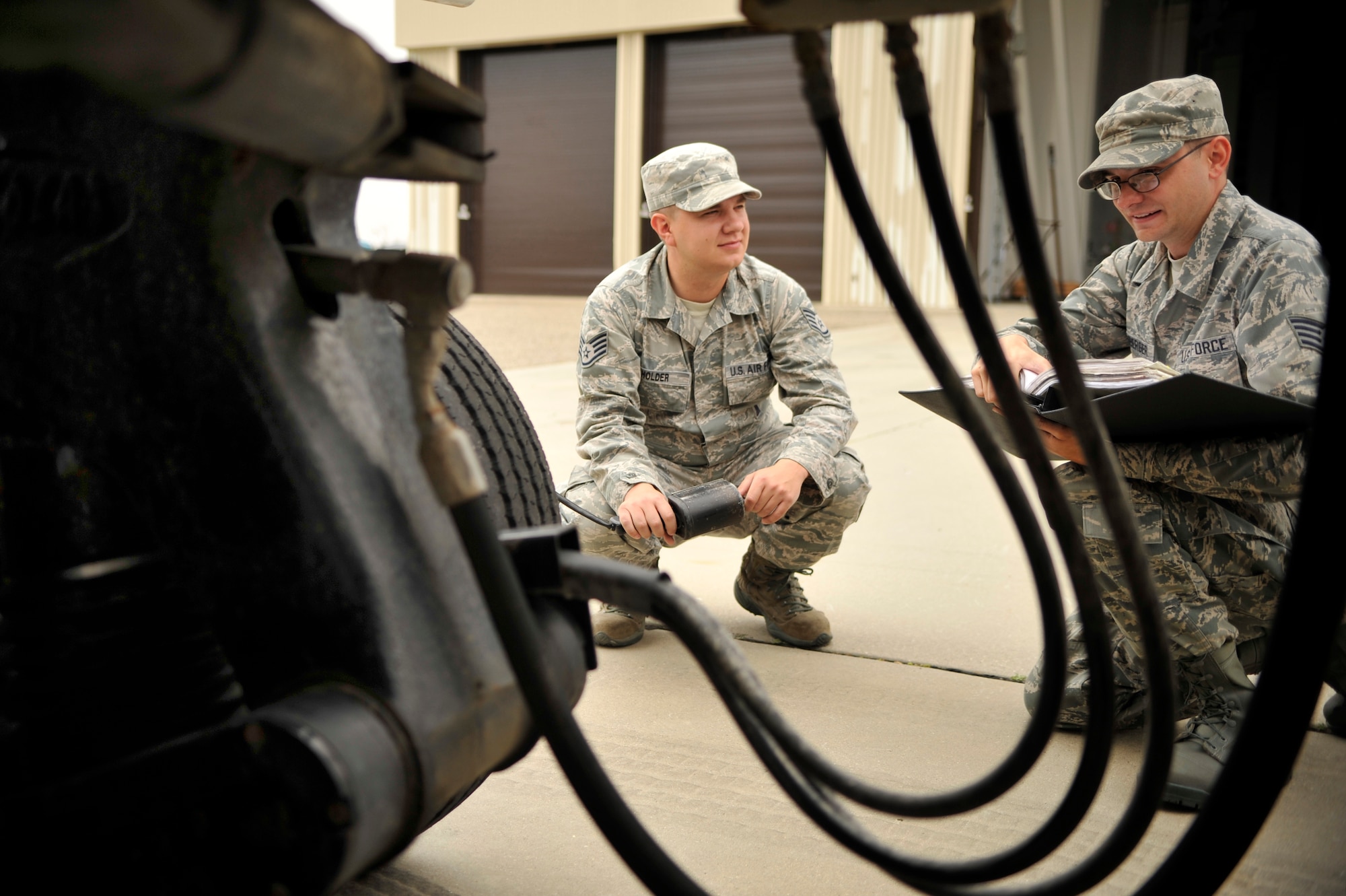 VANDENBERG AIR FORCE BASE, Calif. -- Staff Sgt. Joshua Holder and Staff Sgt. Benjamin Linenberger, 1st Air and Space Test Squadron maintenance technicians, perform a brake test on a Type II Transporter vehicle during a training session here Tuesday, July 19, 2011.  A Minotaur IV rocket is scheduled to launch from Space Launch Complex 8 Aug. 10.  (U.S. Air Force photo/Staff Sgt. Andrew Satran) 

 