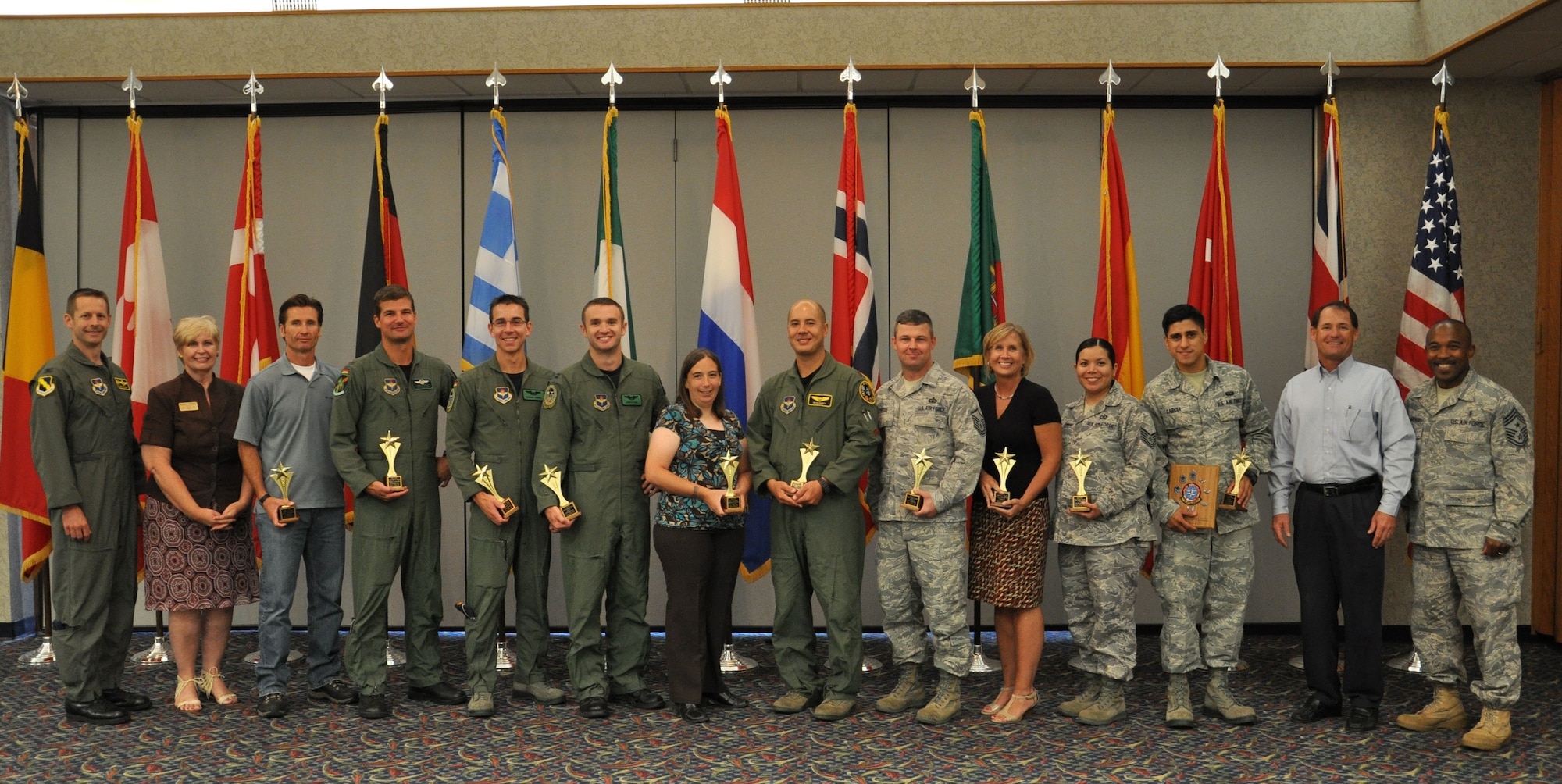SHEPPARD AFB, Texas – The 80th Flying Training Wing congratulates the quarterly award winners July 27th, at the Sheppard Club. From left Col. Dieter Bareihs, 80 FTW Commander, Mrs. Tee Mueller, Mr.  Charles S. DeWolfe, Capt. Marc Skolik, 1st Lt. Manuel Kiefer, Capt. Jason W. Ford, Mrs. Tracy Dorgan, Maj. Peter Duffy, Master Sgt. David Criddle, Mrs. Michele Houck, Tech Sgt. Sendy Cummins,  Airman 1st Class William Garcia, Mr. Rick Hanson and Command Chief Master Sgt. Phillip Browning (U.S. Air Force photo by 2nd Lieutenant Sara Harper).