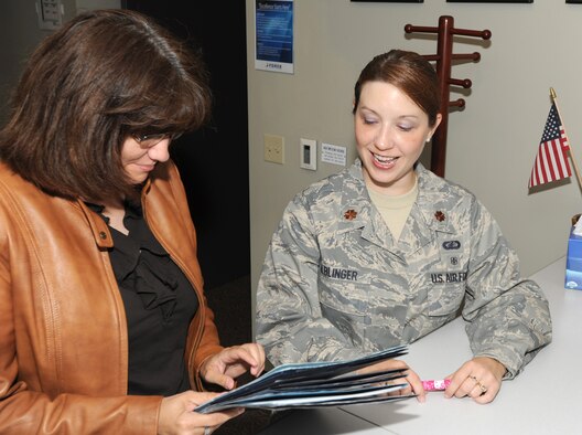 Major Melissa Alblinger, 22nd Force Support Squadron operations officer, reviews staff packages July 28, 2011, McConnell Air Force Base, Kan.  The Newton Falls, Ohio, native manages daily operations of the FSS.  Maj. Alblinger is also the alternate Sexual Assault Response Coordinator for the 22nd Air Refueling Wing. (U.S. Air Force photo/ Airman 1st Class Laura L. Valentine)