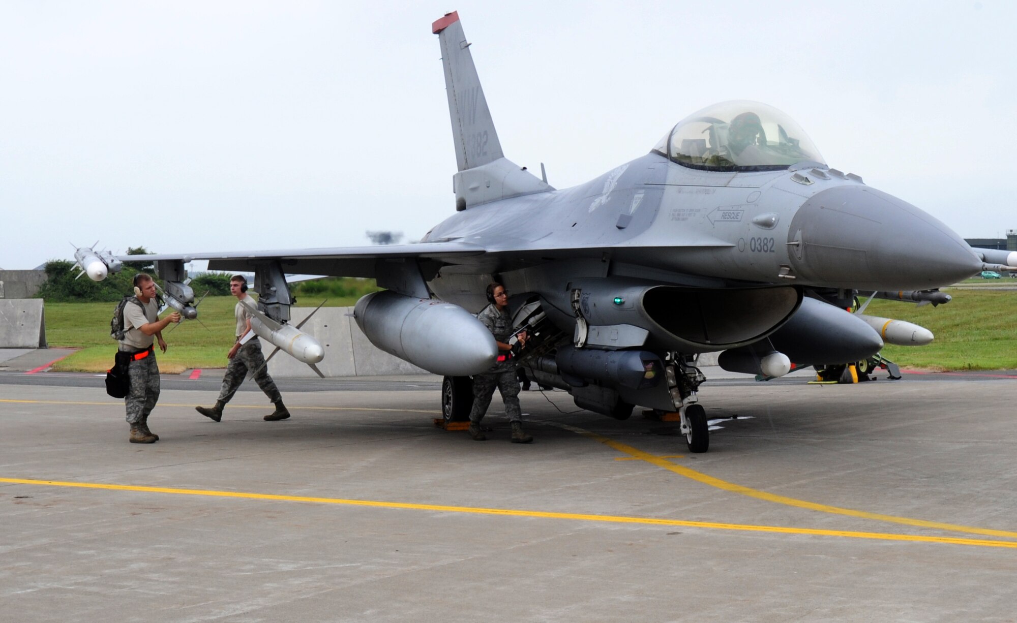 MISAWA AIR BASE, Japan -- Capt. Matt Marshall, 13th Fighter Squadron, stands by while 35th Aircraft Maintenance Squadron maintainers perform a weapons inspection on the aircraft during a training exercise July 28.  The exercise tests the Airmen's ability to operate effectively in a pre-combat environment.  (U.S. Air Force photo/Staff Sgt. April Quintanilla)