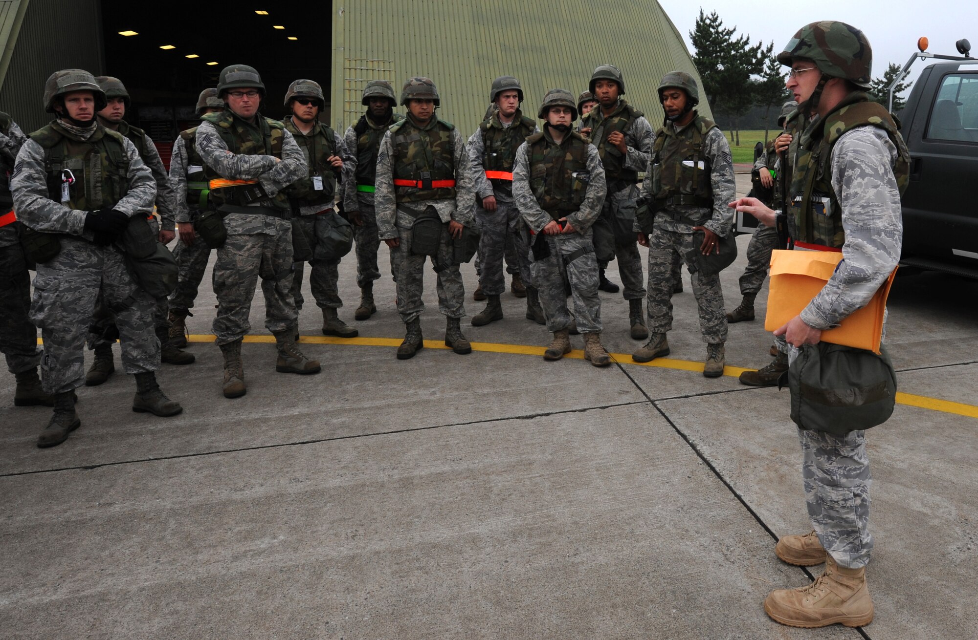 MISAWA AIR BASE, Japan -- Capt. Robert Goodreau, 35th Aircraft Maintenance Squadron, briefs Airmen who have arrived at a simulated deployed location July 28.  The training exercise tests the Airmen's  ability to survive and operate in wartime operations.  (U.S. Air Force photo/Staff Sgt. April Quintanilla)