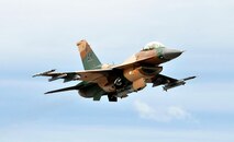 An F-16 Fighting Falcon from the 18th Aggressor Squadron retracts its landing gear after take-off during RED FLAG-Alaska 11-2 July 19, 2011, Eielson Air Force Base, Alaska.  Aggressor pilots are trained to act as opposing forces in exercises like RF-A to better prepare U.S. and allied forces for aerial combat. (U.S. Air Force photo/Staff Sgt. Miguel Lara III)