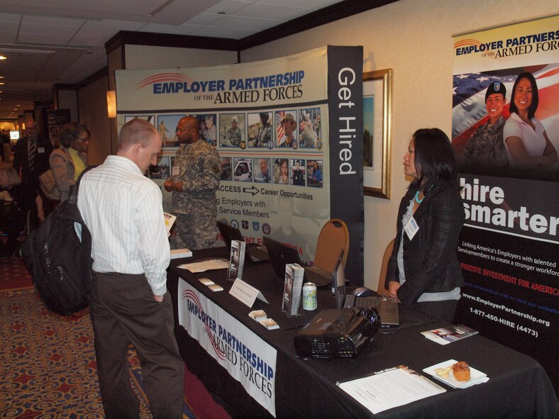 Human resources managers visit the Employer Partnership of the Armed Forces booth and learn how the program can help them find veteran candidates for federal jobs during the Veterans Employment Symposium, July 27, 2011, in Washington, D.C. (U.S. Army photo/Army Lt. Col. Matthew J. Leonard)
