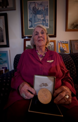 Barry Smith, Women’s Airforce Service Pilot, displays her Congressional Gold Medal at the end of an interview about her life story at Sebring, Fla., July 20, 2011. The Congressional Gold Medal ranks with the Presidential Medal of Freedom as the highest civilian honors bestowed for courage, service and dedication. (U.S. Air Force photo by Airman 1st Class Joshua Green)