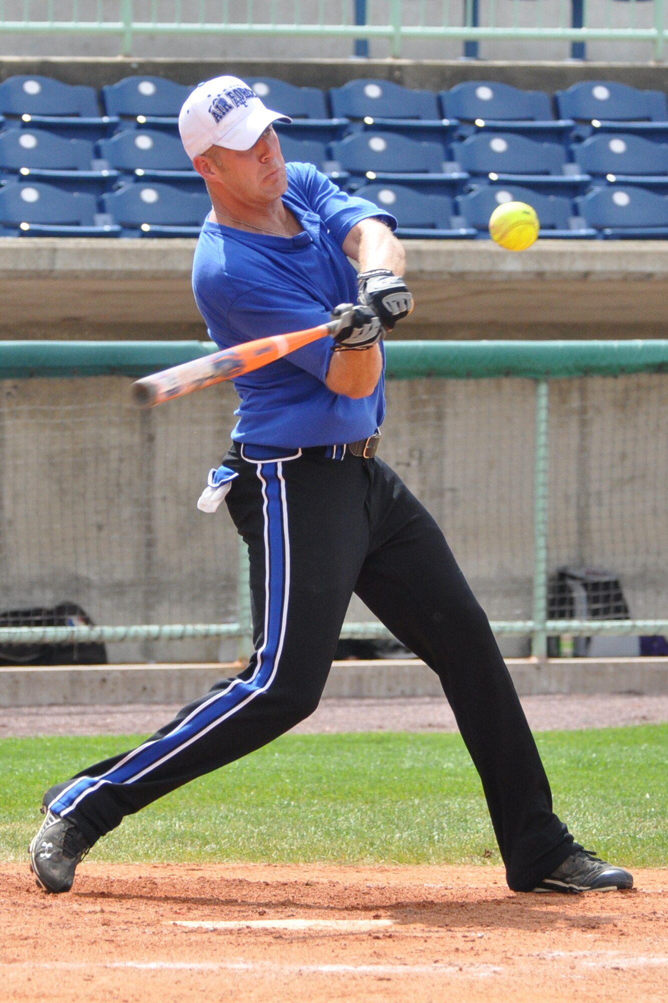 NILES, Ohio -- Air Force Reserve Master Sgt. Scott Smith, an Air Reserve Technician assigned to the 910th Medical Squadron and a member of the 910th Air Force Falcons softball team, based at nearby Youngstown Air Reserve Station (YARS), Ohio, swings at a pitch during an exhibition softball game against the Ohio National Guard Warriors at Eastwood Field here, July, 27, 2011. Sergeant Smith and a large group of Servicemembers, DoD civilians as well as their family and friends participated in several activities as part of a YARS Night Out, a community relations event with the Mahoning Valley Scrappers, a Class A affiliate baseball team in the Cleveland Indians organization. The 910th AF Falcons defeated the Warriors 10-4 and the Scrappers defeated the Lowell Spinners, a Boston Red Sox affiliate team, 5-2 later in the evening. U.S. Air Force photo by Master Sgt. Bob Barko Jr.