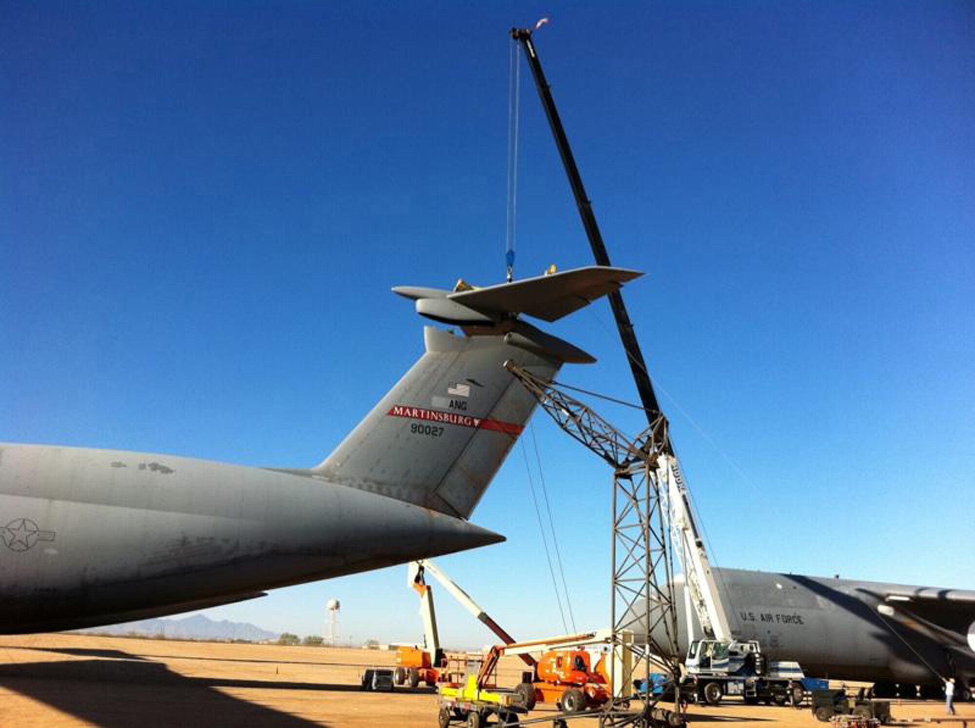 A Robins depot field team retrieves the horizontal stabilizer from a C-5 which was recently retired to the “Boneyard” at Davis-Monthan Air Force Base in Tucson, Ariz. U.S. Air Force photo by Isaac Cruz