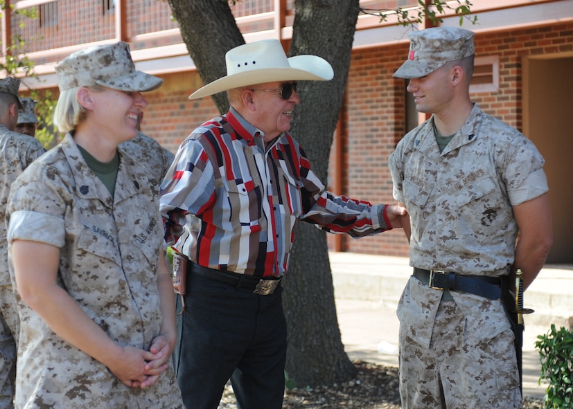 DYESS AIR FORCE BASE, Texas -- Retired Marine Sgt. Maj. Troy Hensley, center, speaks with Staff Sgt. Mindy Savrock, Corporals Course instructor, left, and Cpl. Shane Wilson, Corporals Course student, July 27, 2011. The Marine’s Enlisted Professional Military Education course is a 16-day course held once a year at Dyess. The course teaches Marine noncommissioned officers (corporals) how to lead in today’s Marine Corps. (U.S. Air Force photo by Airman 1st Class Jenifer H. Calhoun/Released)