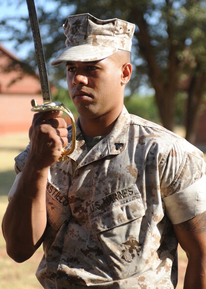 DYESS AIR FORCE BASE, Texas -- Marine Cpl. Bruce Castillo, Corporals Course student, practices sword manual maneuvers during the Corporals Course July 27, 2011. The Marine’s Enlisted Professional Military Education course is a 16-day course held once a year at Dyess. The course teaches Marine noncommissioned officers (corporals) how to lead in today’s Marine Corps. (U.S. Air Force photo by Airman 1st Class Jenifer H. Calhoun/Released)