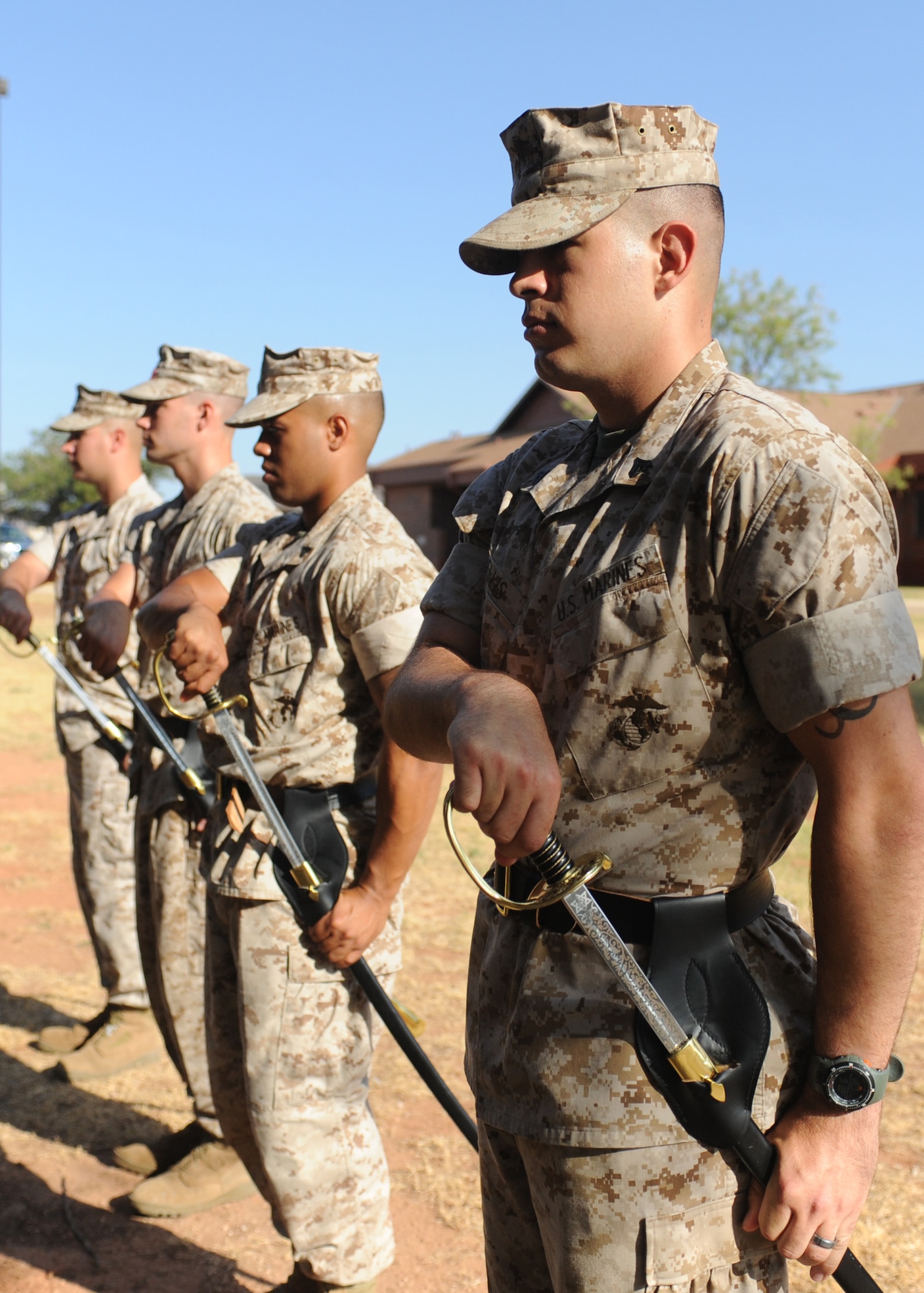 DYESS AIR FORCE BASE, Texas -- Marine corporals practice sword maneuvers during the Corporals Course July 27, 2011. The Marine’s Enlisted Professional Military Education course is a 16-day course held once a year at Dyess. The course teaches Marine noncommissioned officers (corporals) how to lead in today’s Marine Corps. (U.S. Air Force photo by Airman 1st Class Jenifer H. Calhoun/Released)
