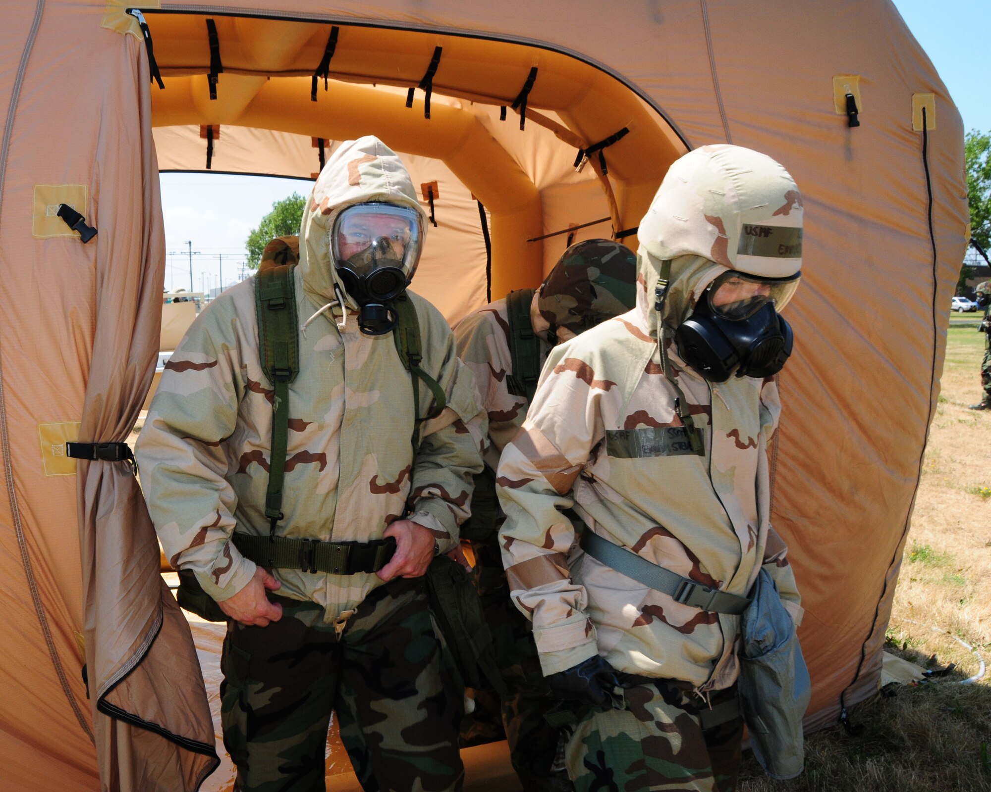 914th Airlift Wing unit members exit out of one of many decontamination stations.  Unit members received training on chemical, biological, radiological, nuclear and explosive training during the July unit training assembly at the Niagara Falls Air Reserve Station on July 25th, 2011. The training is in preparation for the upcoming operational readiness inspection scheduled for July of 2012. (U.S. Air Force photo by Peter Borys)