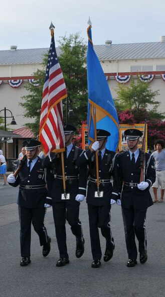 The Dover Air Force Base Honor Guard marches in the nightly parade at the Delaware State Fair Grounds in Harrington, Del., as part of Armed Forces Day July 27, 2011. Military members received free admission. (U.S. Air Force photo by Capt. Marnee A.C. Losurdo)