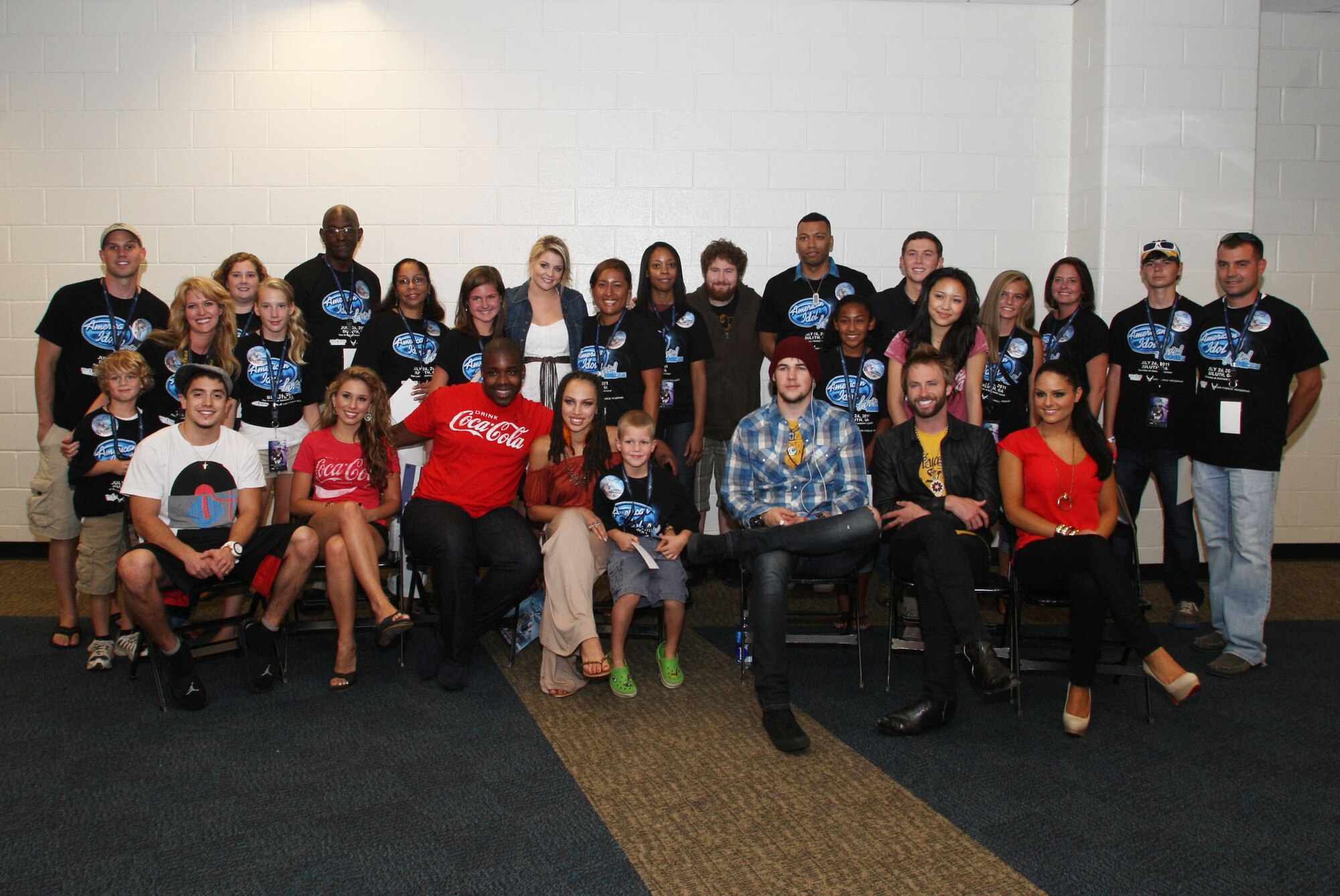 Air Force Reserve personnel and their family members pose with American Idols from season 10 before their live show 26 July, 2011. (U.S. Air Force Photo/Don Peek)