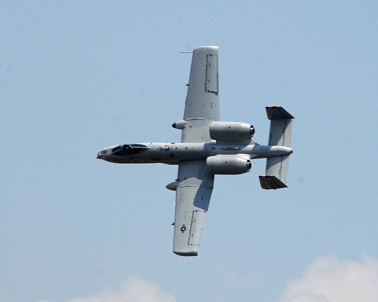 A10 Thunderbolts, nicknamed "Warthogs" for their good looks, makes a hard turn for the crowd. Also known as Tankbusters, this ground attack aircraft has powerful combat weapons that begin with a 30 mm GAU-8/A seven-barrel Gatling gun capable of firing 3,900 rounds per minute. (USAF photo by Ben Strasser) 

