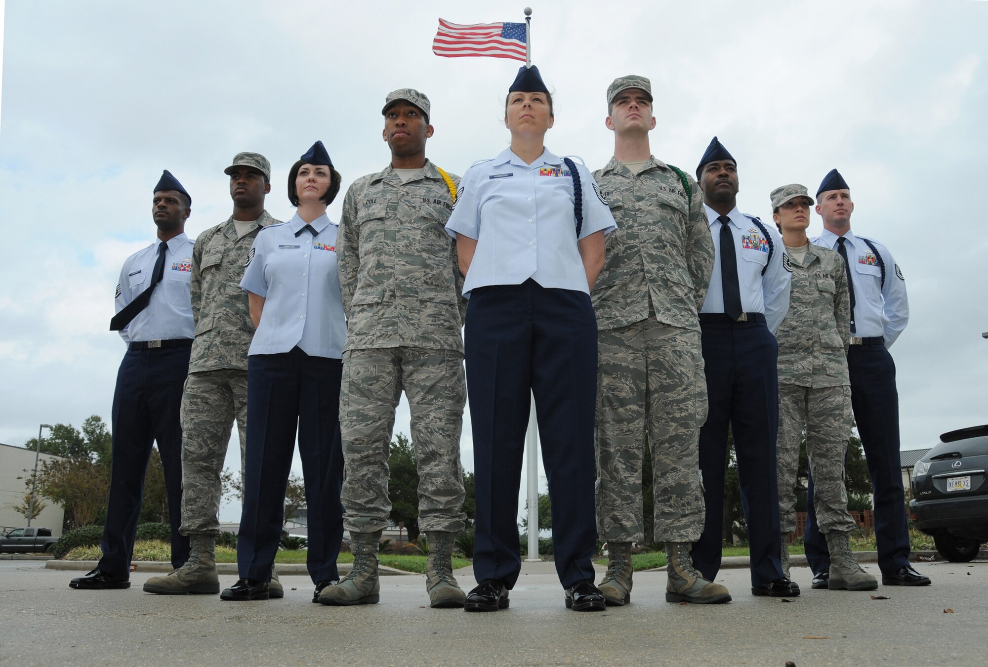 From left, Staff Sgt. Lamar Gardner, 334th Training Squadron; Airman Basic Colby Cox, 336th TRS; Staff Sgt. Jennifer Hamilton, 81st Training Group; Airman Basic Bryar Cole, 336th TRS; Tech. Sgt. Julie Hammond, 81st TRG; Airman 1st Class Shawn Scott, 334th TRS; Tech. Sgt. Terrance Boyd, 336th TRS; Airman 1st Class Megan Lima, 338th TRS; and Tech. Sgt. Steven Clinton, 81st TRG, stand at the flagpole in front of the Levitow Training Support Facility. Gardner, Hamilton, Hammond, Boyd and Clinton are military training leaders and Cox, Cole, Scott and Lima are students.  (U.S. Air Force photo by Kemberly Groue)
