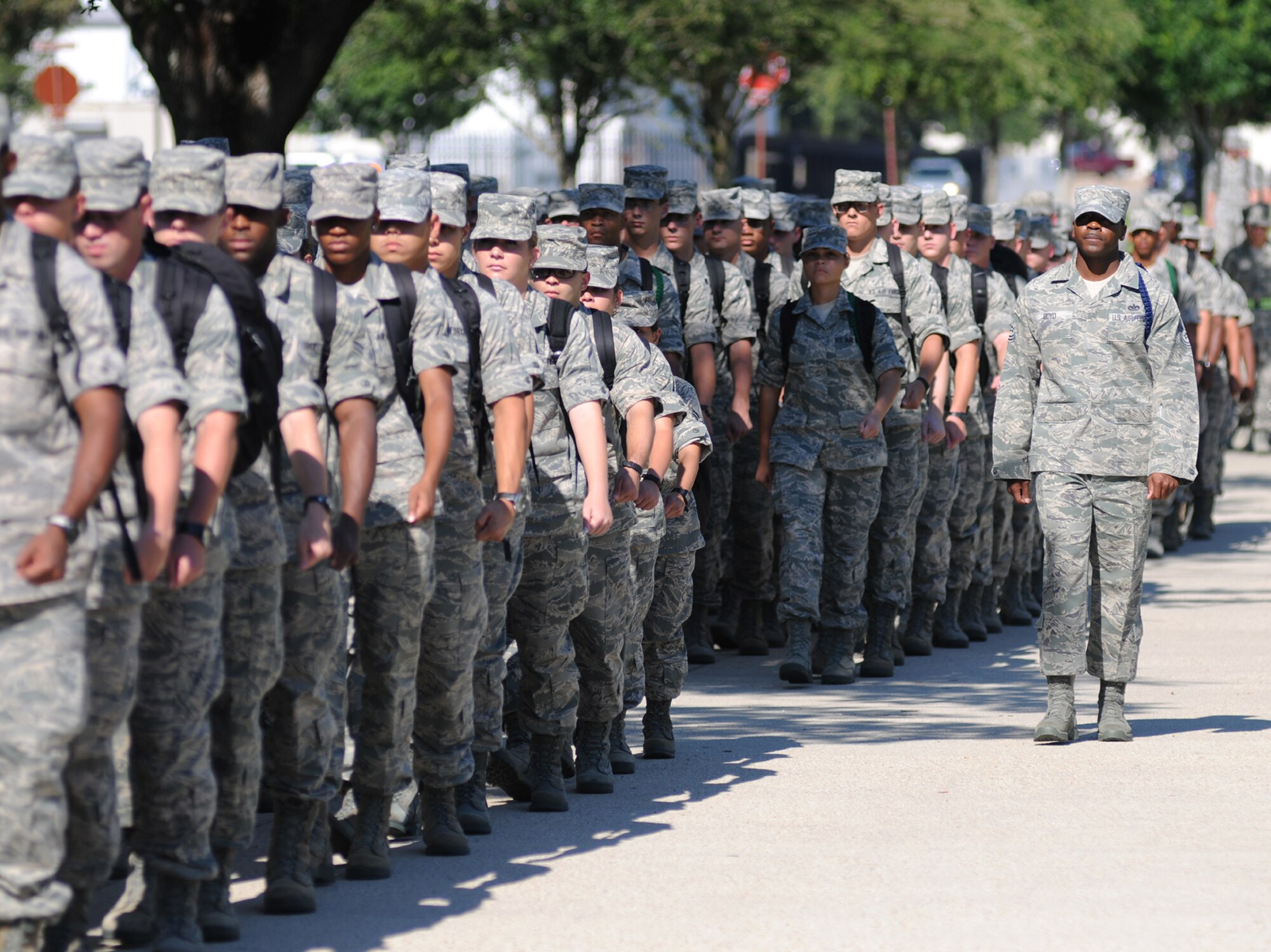 Tech. Sgt. Terrance Boyd, right, a Military Training Leader in the 336th Training Squadron, marches toward the Triangle with some of his squadron’s students.  (U.S. Air Force photo by Kemberly Groue)