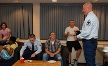HANSCOM AIR FORCE BASE, Mass. – Chief Master Sgt. Baird A. Stiefel (right), 66th Air Base Group superintendent, talks to dorm residents during the dorm dinner July 25. The dorm dinner gave residents a chance to speak with senior leaders from across the base in a casual setting. (U.S. Air Force photo by Mark Herlihy) 
